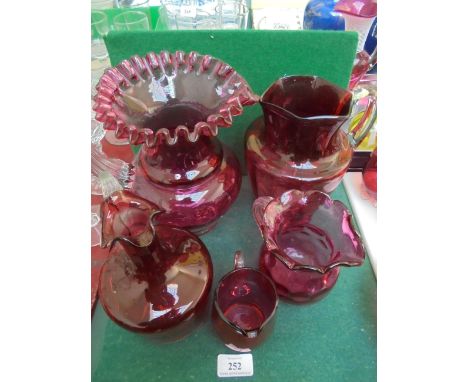 Selection of 5 various cranberry and ruby glass jugs of various styles and ages