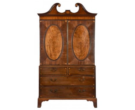 A GEORGE III MAHOGANY AND INLAID LINEN PRESS, C1790  the upper part fitted with three trays( but to accommodate four), 217cm 