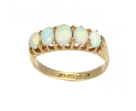 AN OPAL RING  in 18ct gold, Chester 1901, 3.7g, size L ++The opals retaining some polish but showing slight signs of wear alt