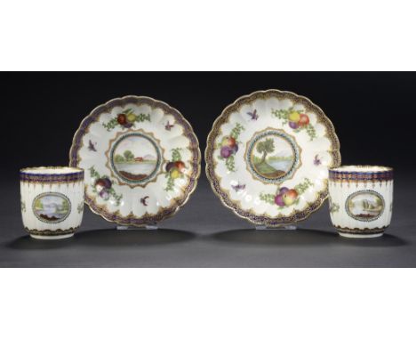 A PAIR OF WORCESTER FLUTED DALHOUSIE PATTERN COFFEE CUPS AND SAUCERS, C1780-90 painted with a central landscape, fruit and in
