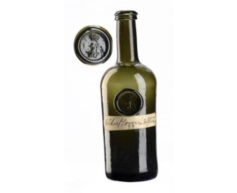 AN ENGLISH GLASS HALF SIZE CYLINDER BOTTLE, BAGOT SEAL, C1760-1800 22.5cm h, with affixed handwritten label Elderflower Water