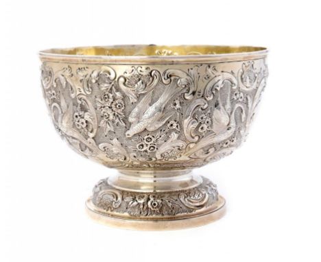 A VICTORIAN SILVER ROSE BOWL chased with birds and flowers, 20.5cm diam, by The Goldsmiths & Silversmiths Co, London 1896, 21