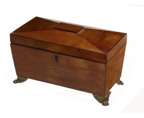 A GEORGE IV SATINWOOD AND LINE INLAID TEA CADDY, C1830  of sarcophagus shape on embossed brass feet, with fitted interior, 32