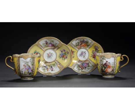 TWO MEISSEN LOBED YELLOW GROUND CUPS AND A SAUCER, LATE 19TH/EARLY 20TH C  painted with panels of figures and flowers, saucer