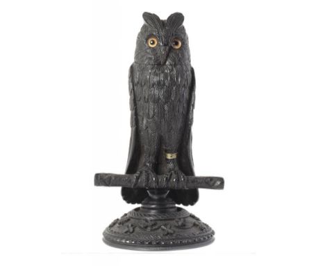 AN IRISH   CARVED BOG OAK OWL NOVELTY INKWELL with glass eyes, the interior with shamrock carved cap, 23.5cm h ++In good cond