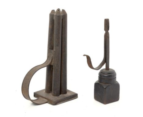 AN ENGLISH WROUGHT IRON RUSHLIGHT, 18TH C  on associated wood block, 24cm h and a sheet iron four candle mould, 19th c (2) ++