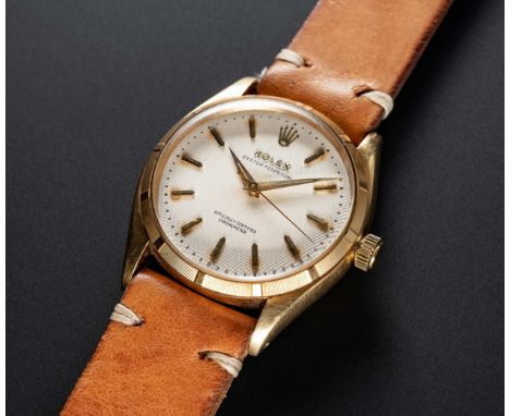 A RARE GENTLEMAN'S 18K SOLID GOLD ROLEX OYSTER PERPETUAL WRIST WATCHCIRCA 1956, REF. 6565 WITH "HONEYCOMB" DIAL, "HOMMAGE DES