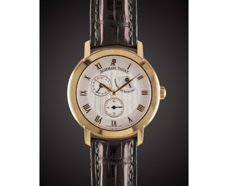 A GENTLEMAN'S 18K SOLID ROSE GOLD AUDEMARS PIGUET "JULES AUDEMARS COLLECTION" POWER RESERVE CALENDAR WRIST WATCHDATED 2004, R