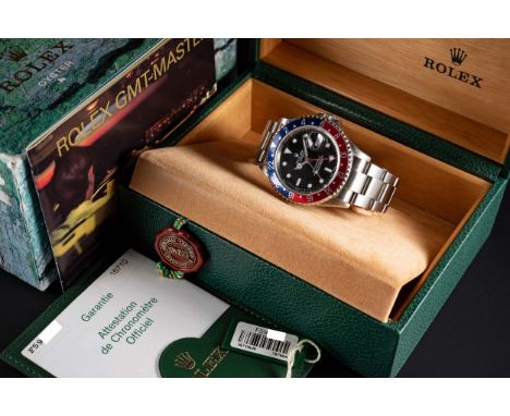 A GENTLEMAN'S STAINLESS STEEL ROLEX OYSTER PERPETUAL DATE GMT MASTER II BRACELET WATCHDATED 2004, REF. 16710 WITH ORIGINAL BO