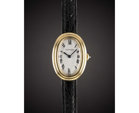 A LADIES 18K SOLID GOLD CARTIER BAIGNOIRE WRIST WATCHCIRCA 1980sMovement: Manual wind, signed Cartier.Case: Approx. 32mm by 2