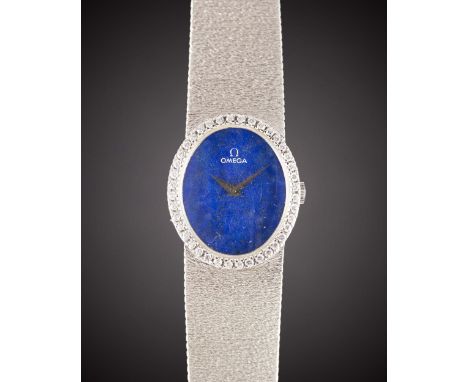 A LADIES 18K SOLID WHITE GOLD & DIAMOND OMEGA BRACELET WATCHCIRCA 1977, REF. 7-854 WITH LAPIS LAZULI DIALMovement: Manual win