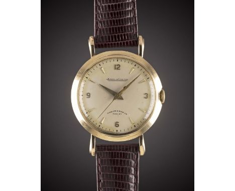 A GENTLEMAN'S 9CT SOLID GOLD JAEGER LECOULTRE WRIST WATCHCIRCA 1955, RETAILED BY PIDDUCK & SONS LTD HANLEYMovement: Manual wi