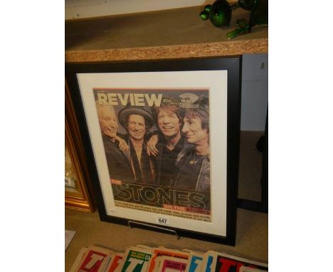 A framed and glazed newspaper page featuring The Rolling Stones.