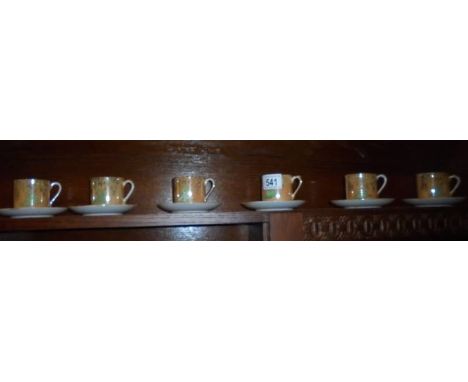 Six Japanese tea cups and saucers.