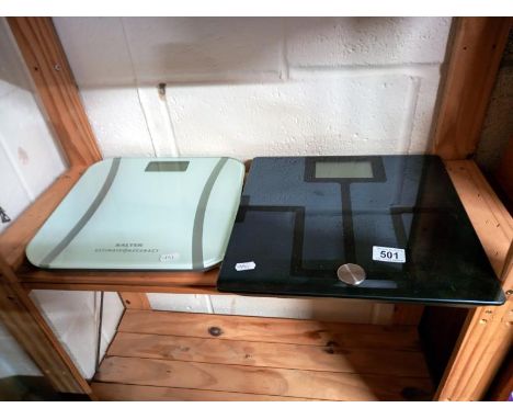 Two sets of bathroom scales.