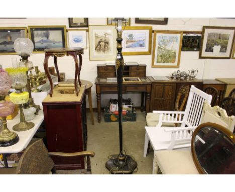 An oriental black lacquered and chinoiserie standard lamp