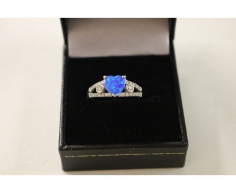 A silver and opal set dress ring 