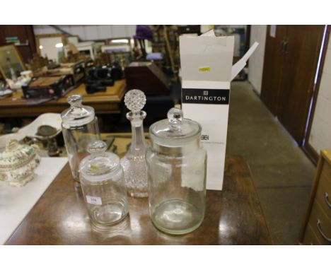 Three glass storage jars; a glass ships decanter etc. 
