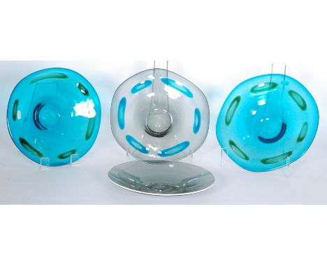 Three Whitefriars shallow bowls with applied coloured spots, designed by Geoffrey Baxter circa 1969 to 1971, comprising two 9