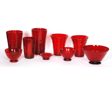 A collection of assorted Whitefriars Ruby glass to include optic wave and ribbon trailed vases and bowls (qty)