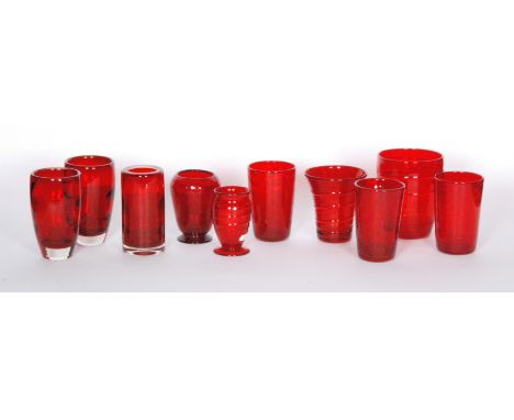 Nine assorted Whitefriars Ruby glass vases of varying form to include optic wave, ribbon trailed and swags examples (9)