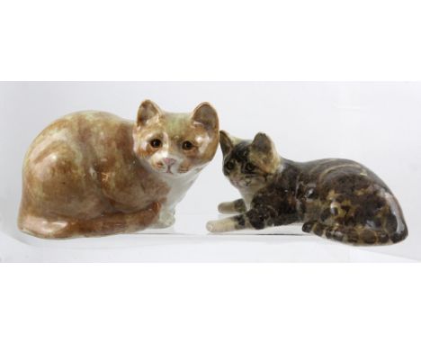 One large and one small ceramic Winstanley cats with glass eyes, one a tabby, the other a ginger tom cat, approx height 17cm 
