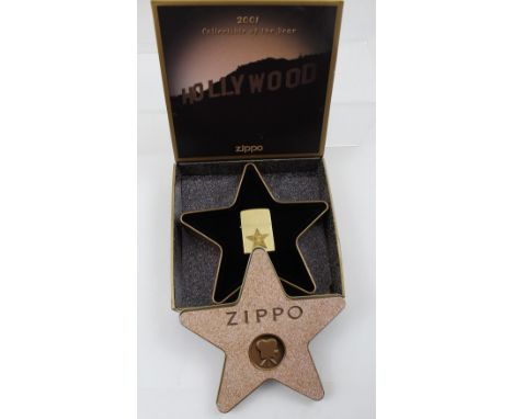 A boxed Zippo 2001 collectible of the year 'Hollywood Leading Lights' cigarette lighter.