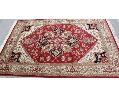 A modern red ground Heriz carpet, 230 x 160cm.