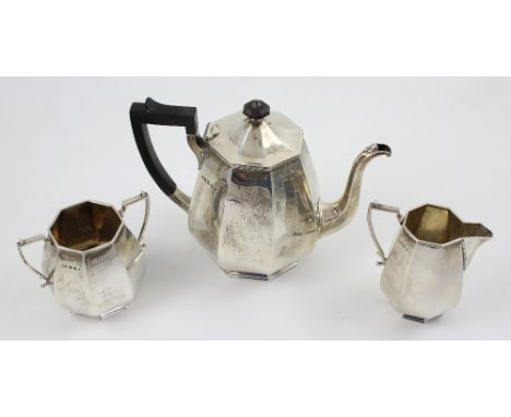 A hallmarked silver Art Deco three-piece tea service comprising teapot, twin-handled sugar bowl and milk jug, James Deakin &a