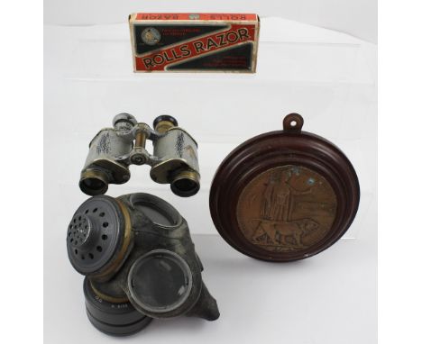 A set of WWI Dolland of London military binoculars in brown leather case, marked with a broad arrow, a WWI commemorative plaq