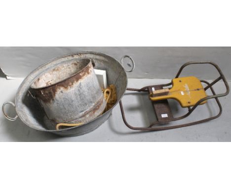 A vintage zinc tin bath, a circular metal planter and a c1950s metal and wood children's rocking horse (af).