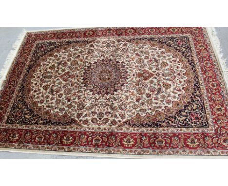 A modern beige ground Keshan carpet, 190 x 140cm.