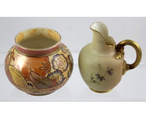 A Royal Worcester blush ivory milk jug, c1900 (af) and a Charlotte Reid for Bursley ware vase decorated with stylised fruit a