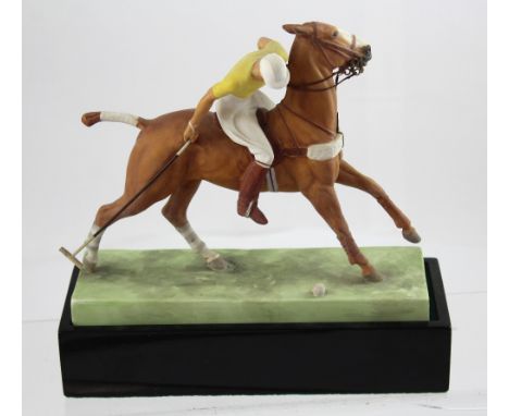 A 1936 Doris Lindner for Royal Worcester ceramic figure of a polo player featuring a mounted figure in yellow jersey about to