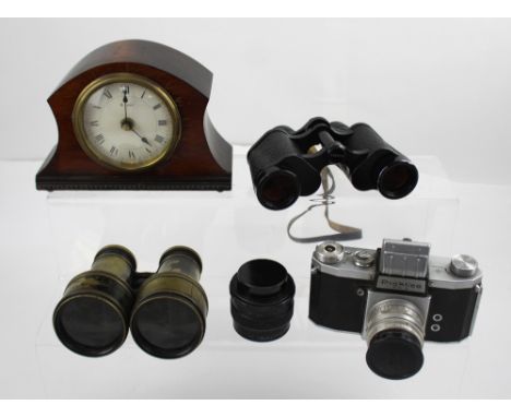 A cased pair of Karl Zeiss Jenna binoculars 8 x 30, a pair of early 20th century field glasses, a cased Praktica FX2 camera, 