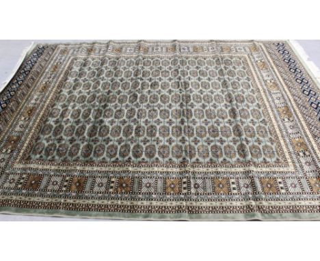 A modern green ground Bokhara carpet, 280 x 200cm.