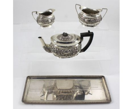 An Edward VII silver three-piece bachelor's tea service, William Henry Leather, Birmingham 1904 and a Continental silver tray