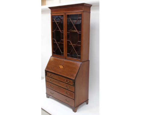An Edwardian bureau bookcase, the elevated top section with satinwood banding, astragal-glazed top with adjustable shelves to