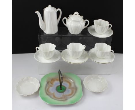 A Shelley 'Dainty' blanc de Chine part coffee service comprising four cups, six saucers, sugar bowl, coffee pot and two small