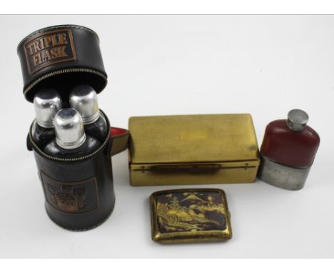 A triple spirit flask set in cylindrical leather case, height 19.5cm, a small glass hip flask with pewter sleeve cup, a Vicer