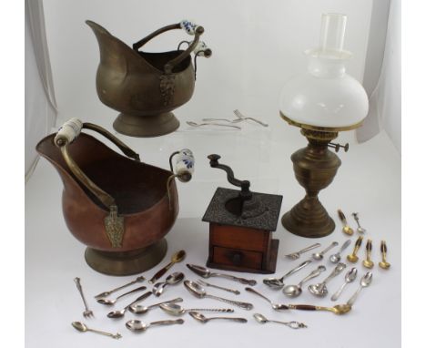 A brass coal bucket and a copper coal bucket both with blue and white ceramic carrying handles, a vintage mahogany and metal 