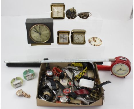 A quantity of ladies' and gentlemen's wristwatches, watch parts, vintage clocks, a mahogany-cased surveyors' measuring instru