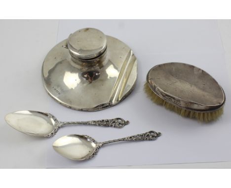 A George VI large hallmarked silver capstan inkwell, Birmingham 1939, diameter 16.5cm, two 803 grade silver spoons and a silv