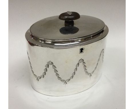 A good George III silver tea caddy with scroll decoration. London 1800. Approx. 394 grams. Est. £1200 - £1500.