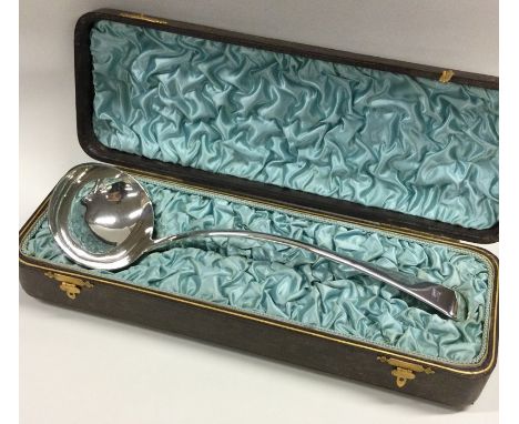 A large silver fiddle pattern sauce ladle contained within a fitted box. London 1814. By TB. Approx. 195 grams. Est. £150 - £