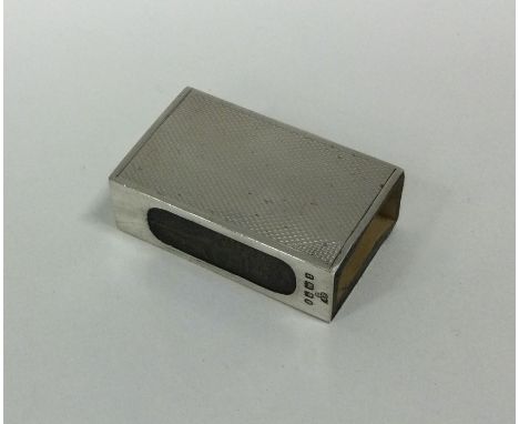 An engine turned silver match case. London 1934. Retailed by Harrods. Approx. 14 grams. Est. £20 - £30.