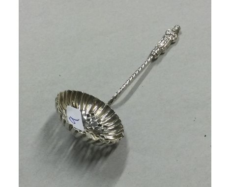 A silver Apostle top sifter spoon. Birmingham. Approx. 10 grams. Est. £20 - £30.