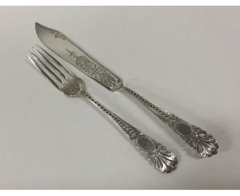 An attractive Victorian silver butter knife together with matching fork. London 1873. By Barnards. Approx. 56 grams. Est. £45