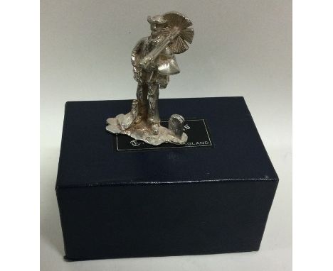 A cast silver figure of a chimney sweep in presentation case with original label. Retailed by S. Warrender &amp; Co. London 1