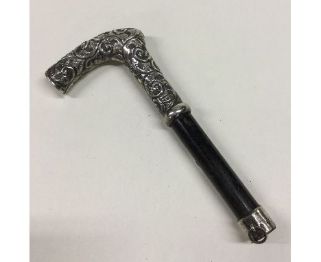 A good silver mounted walking stick with embossed decoration. Birmingham. Approx. 64 grams. Est. £30 - £50.